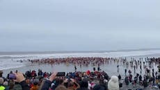 Swimmers run into icy sea for New Year's Day dip on Devon beach