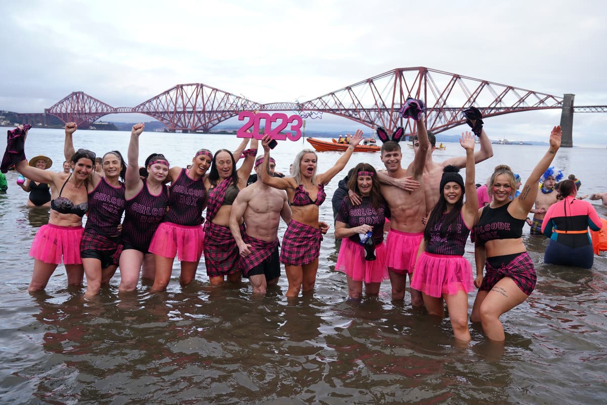 In Pictures: Hundreds brave icy waters for New Year’s Day dip