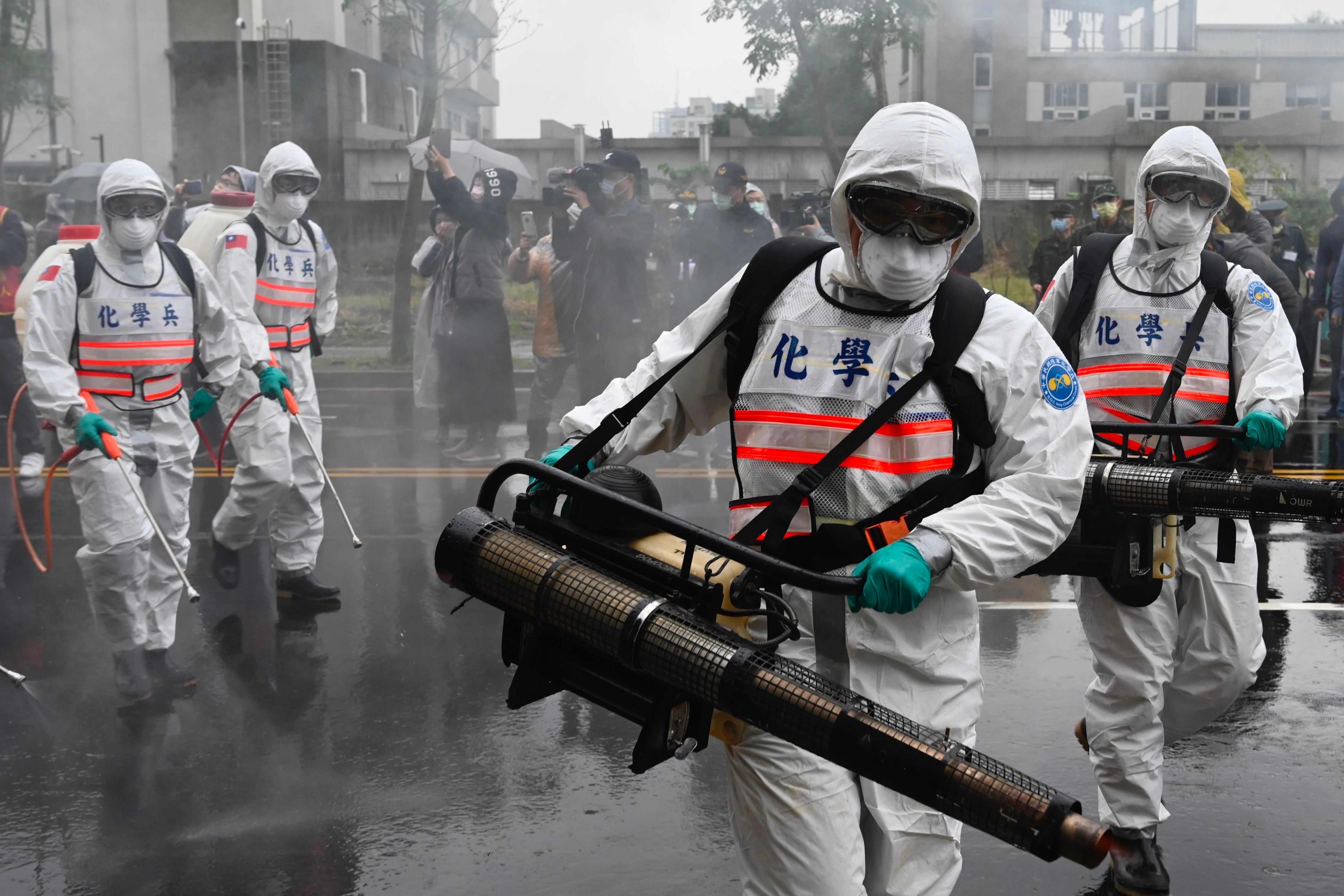 Soldiers from the militarys chemical units take part in a drill organised by the New Taipei City government in March 2020 to prevent the spread of Covid