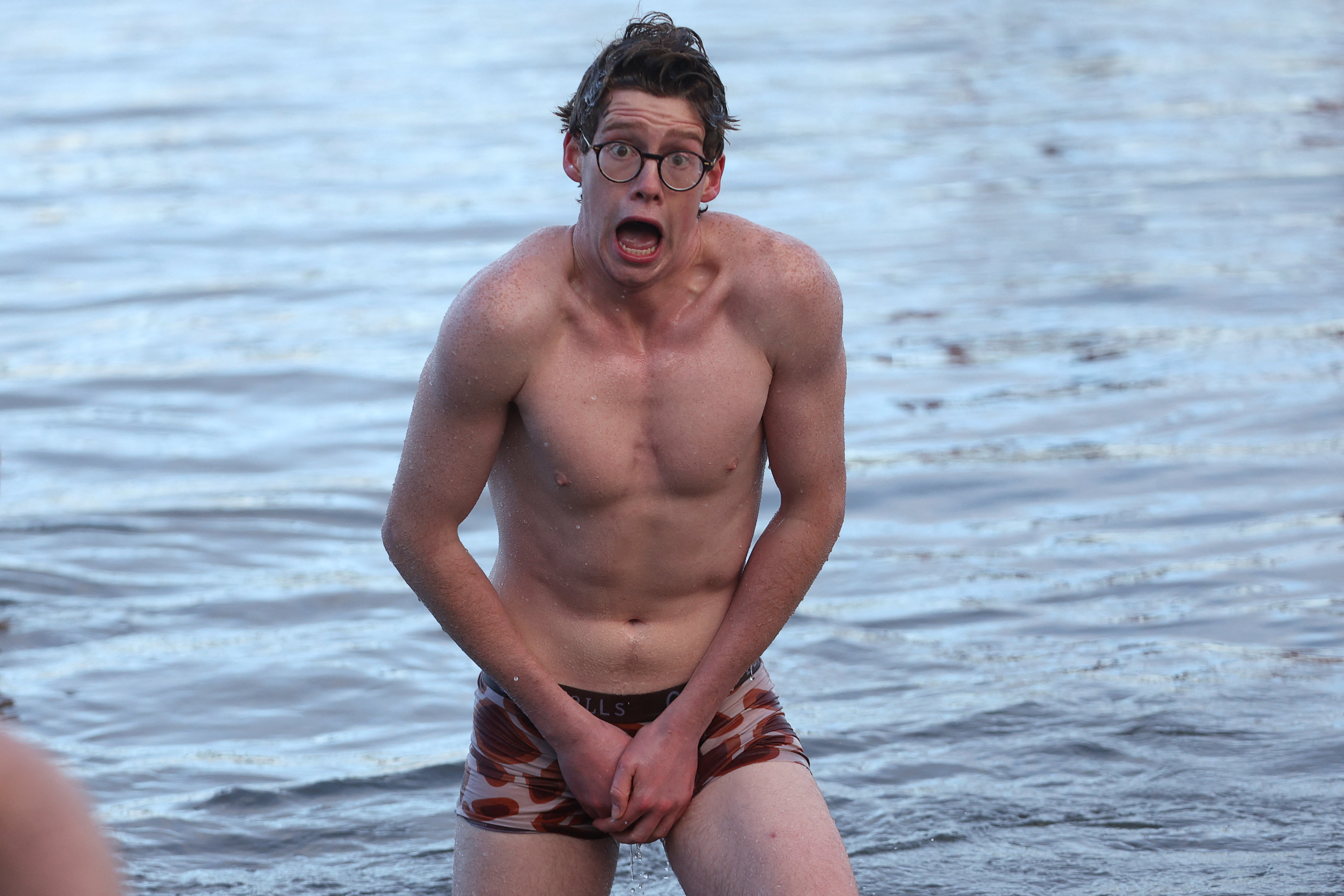A reveller reacts as they participate in the loony dook at South Queensferry
