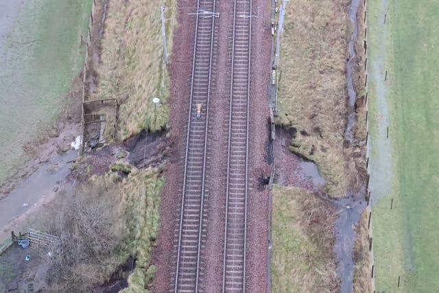 <p>Danger zone: Aerial picture of the flood damage on the West Coast main line </p>