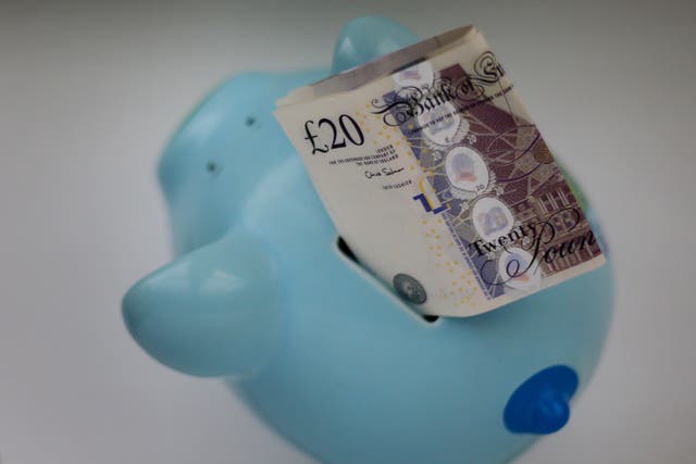 A third of respondents said they had to dip into their savings in the last three months to get by (Gareth Fuller/PA)