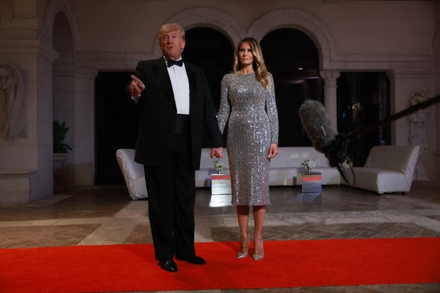 <p>Former president Donald Trump and former first lady Melania Trump arrive for a New Year's party at his Mar-a-Lago home in Florida</p>