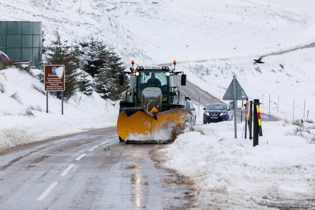 <p>A snow plough clears the A939 after heavy snowfall in the Scottish Highlands</p>