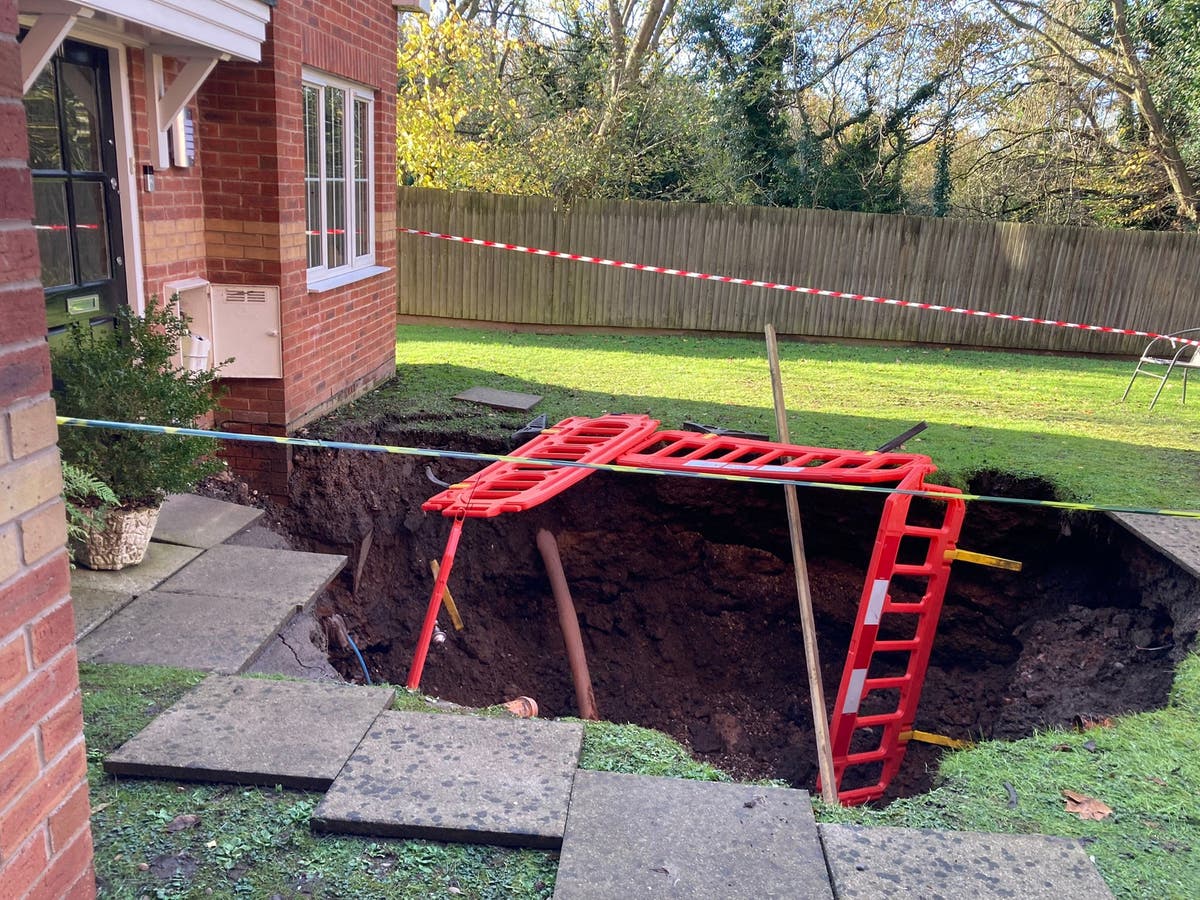 Man cheats death after 70ft sinkhole swallows his garden