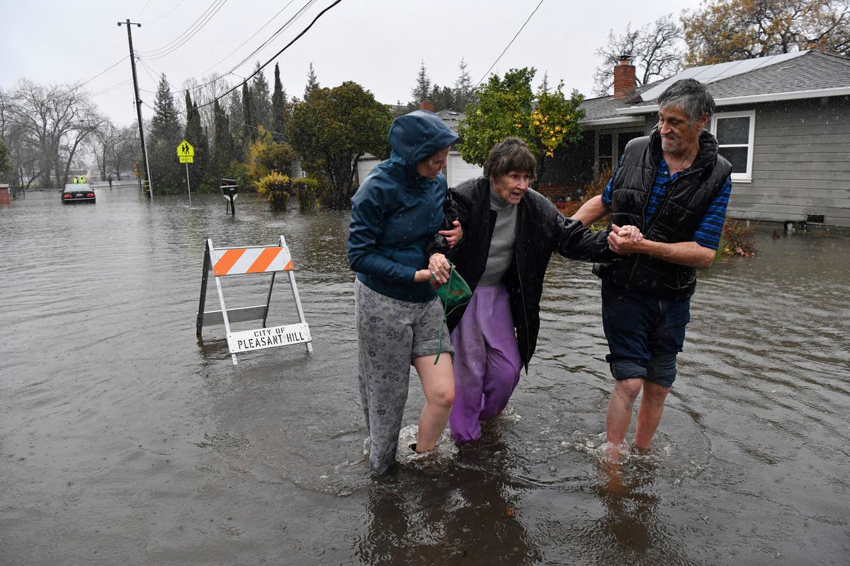 One killed and thousands under evacuation orders from ‘life-threatening’ California flooding