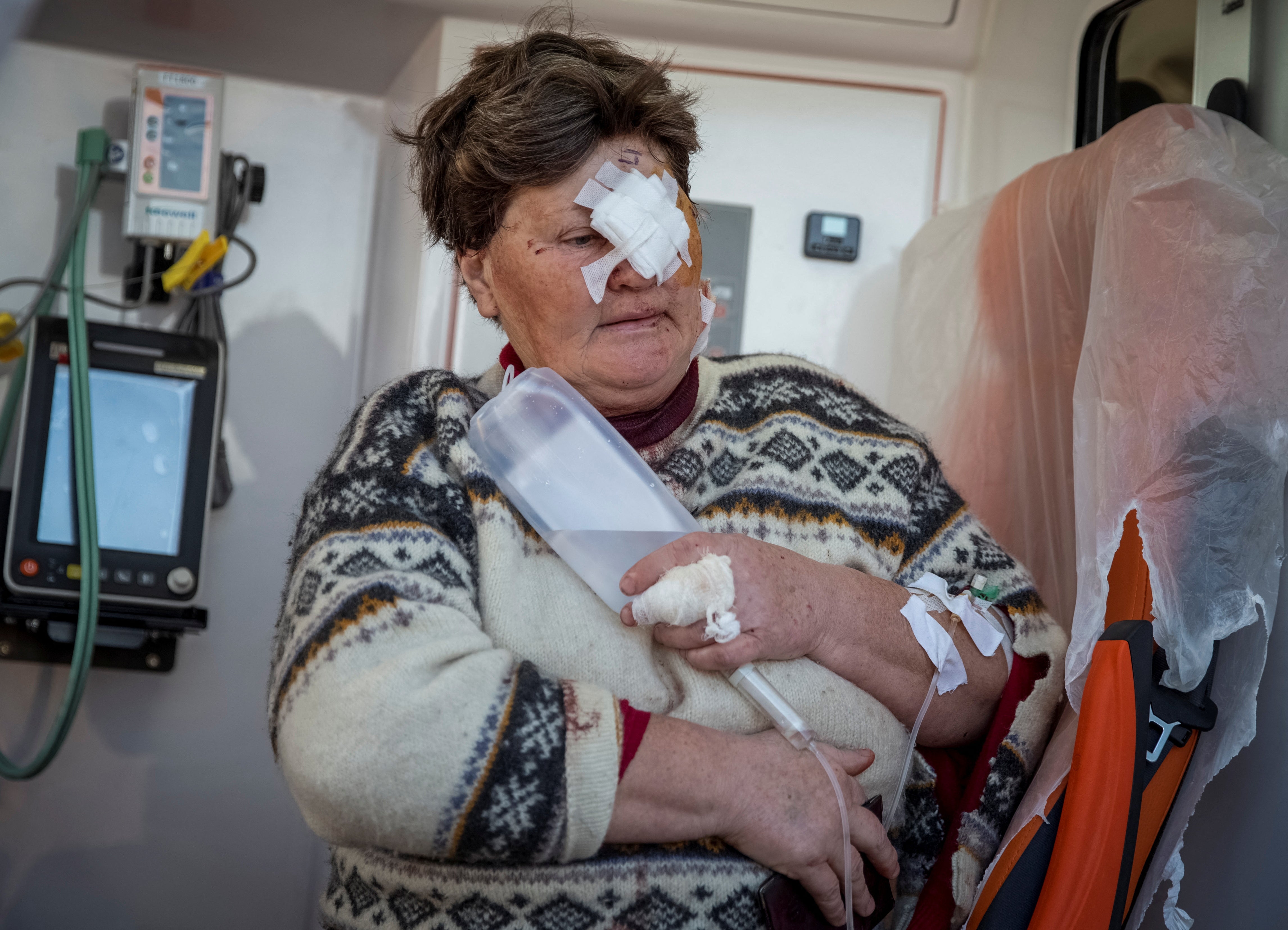 A local woman is taken to hospital after being wounded in a Russian strike in Berislav in Kherson region