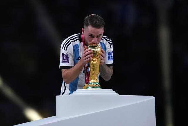 Argentina’s Alexis Mac Allister kisses the World Cup trophy (Mike Egerton/PA)