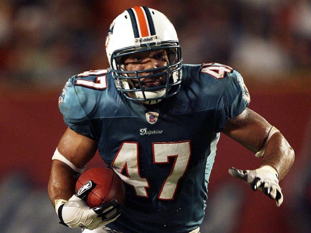 <p> Tight end Teyo Johnson #47 of the Miami Dolphins looks for room to run against the St. Louis Rams during their preseason game at Dolphin Stadium on August 31, 2006 in Miami, Florida</p>