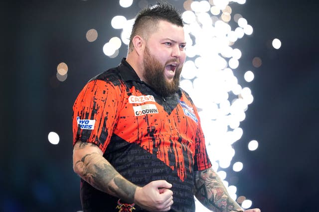 Michael Smith booked his third World Championship final place in five years (Zac Goodwin/PA)