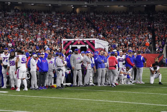 <p>Buffalo Bills players look on after teammate Damar Hamlin #3 collapsed on the field after making a tackle against the Cincinnati Bengals during the first quarter at Paycor Stadium on January 02, 2023 in Cincinnati, Ohio</p>