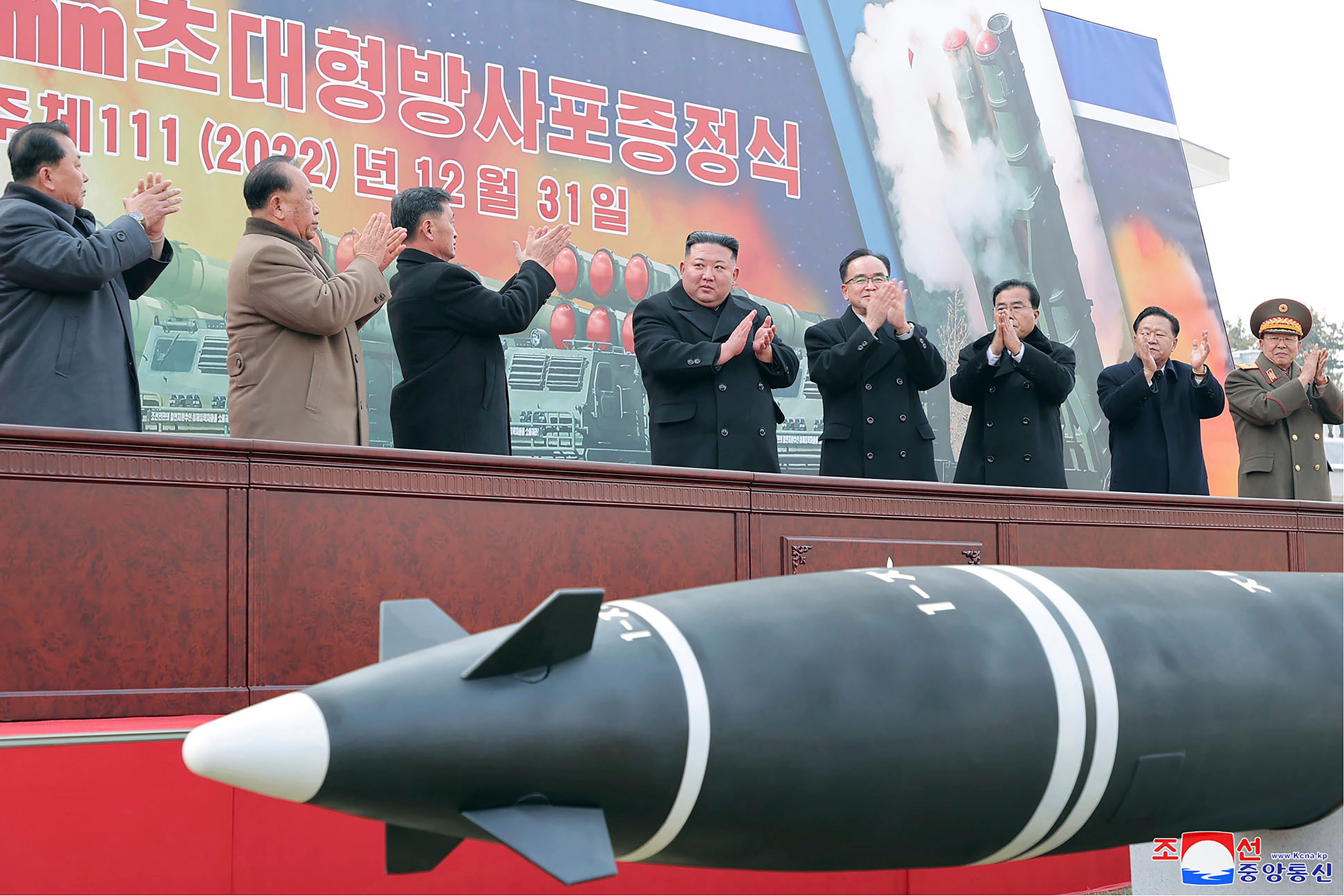 North Korean leader Kim Jong-un, center, attends a ceremony of donating 600mm super-large multiple launch rocket system at a garden of the Workers’ Party of Korea headquarters in Pyongyang