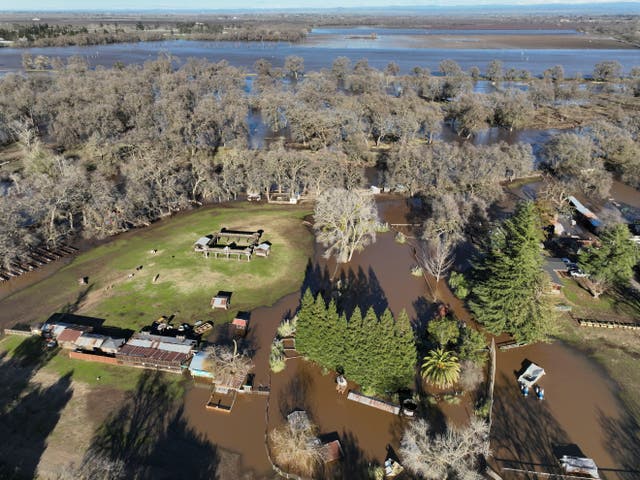 <p>An aerial view shows the damage after rainstorms caused a levee to break, flooding Sacramento County roads near Wilton, California on 1 January 2023</p>