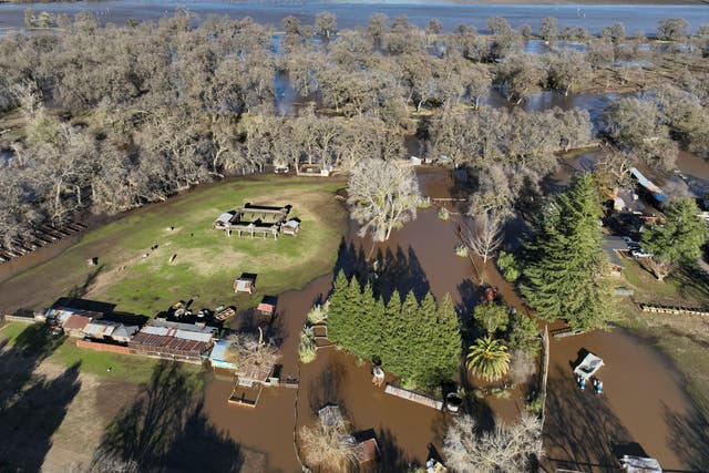 <p>An aerial view shows the damage after rainstorms caused a levee to break, flooding Sacramento County roads near Wilton, California on 1 January 2023</p>