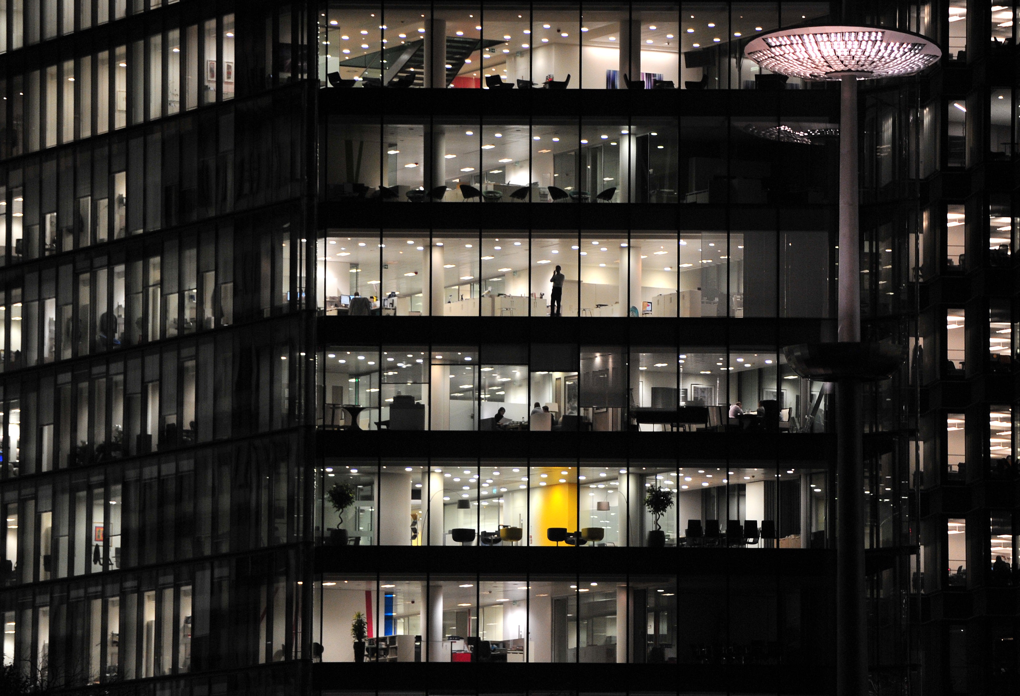 Office workers in a building along the River Thames