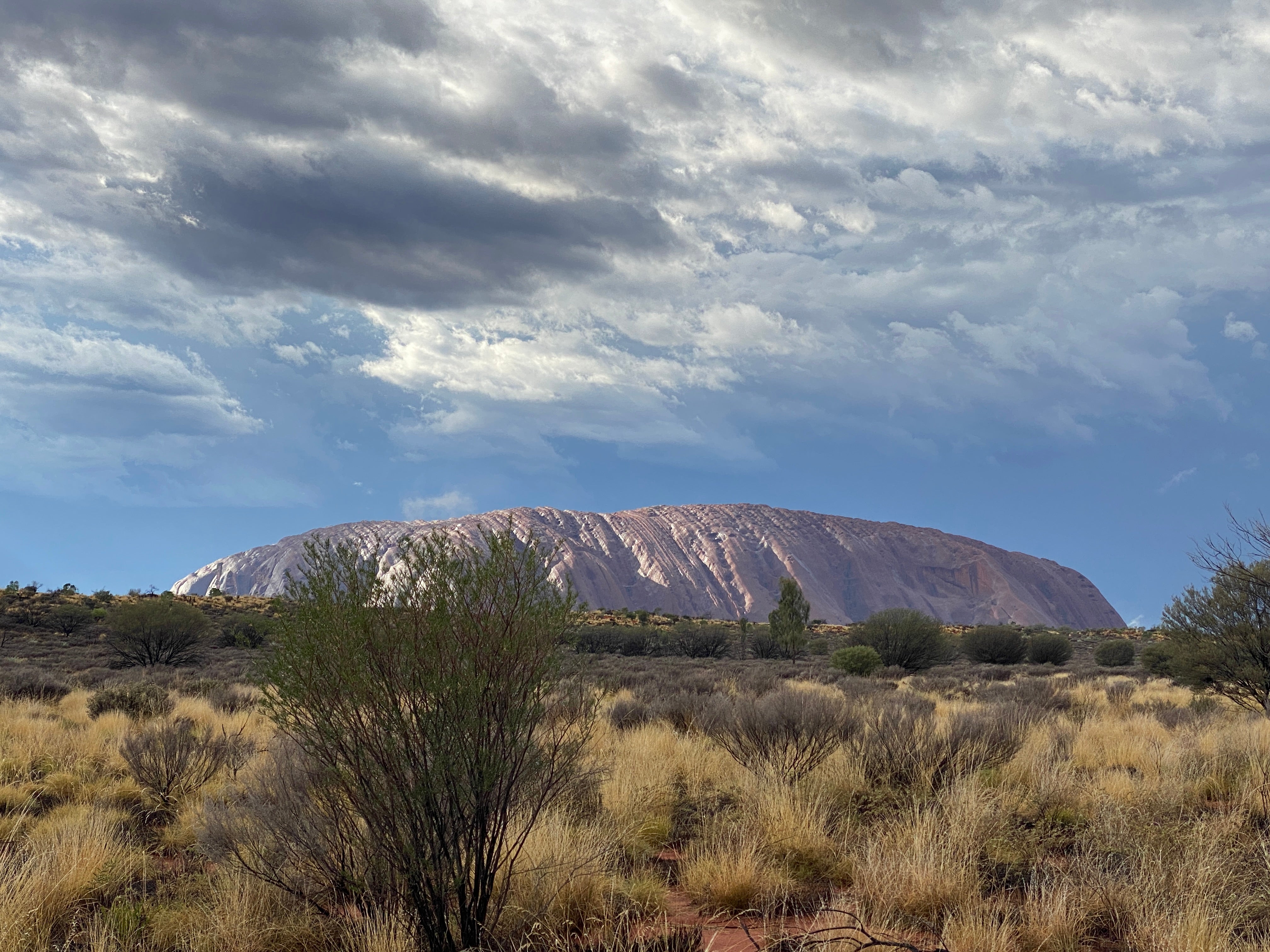 Uluru is best enjoyed over the course of a day, taking in its sights, sounds and smells