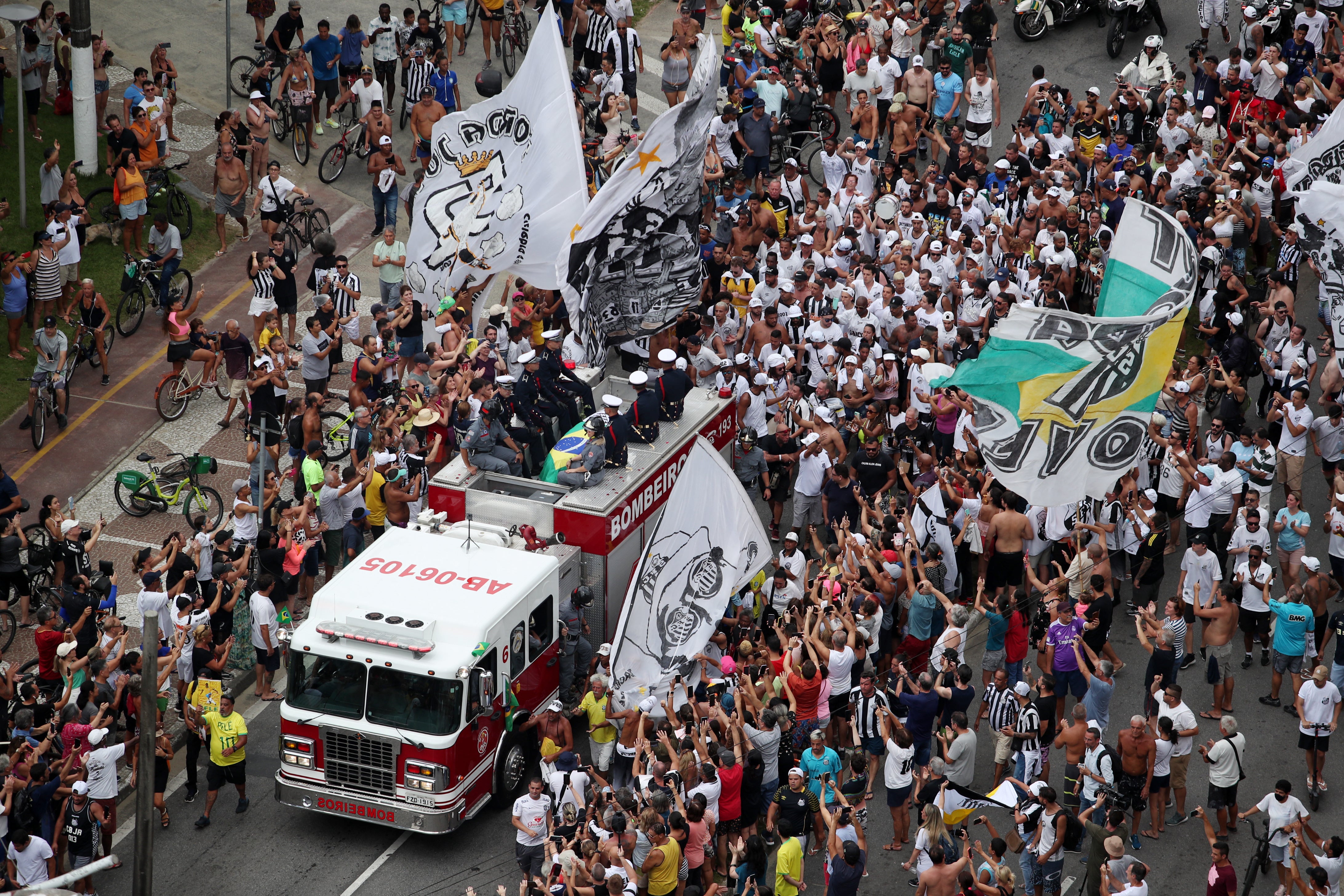 Thousands gathered on the streets and in Santos’ stadium to pay tribute to Pelé