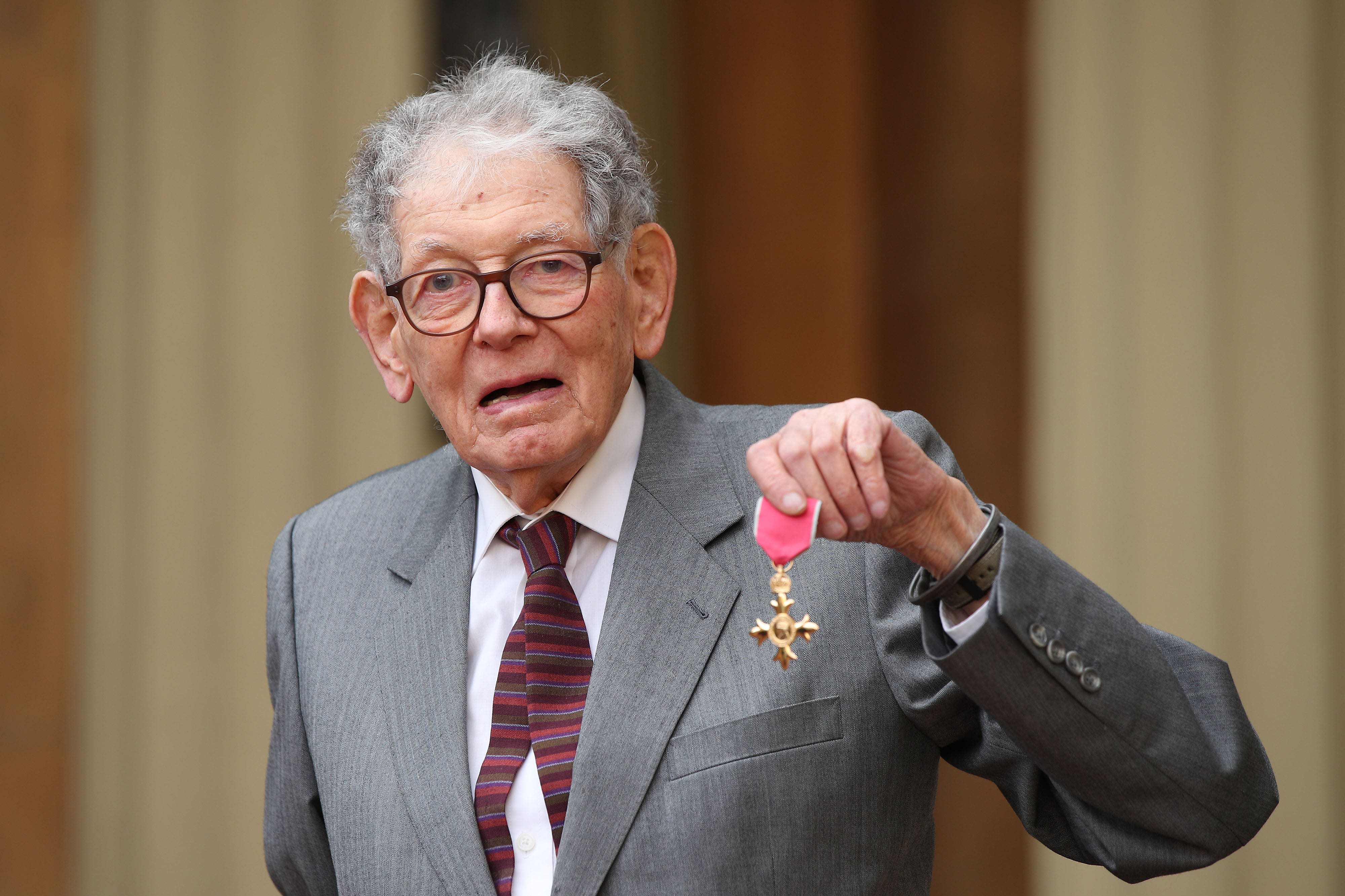 Tom Karen with his OBE (PA)