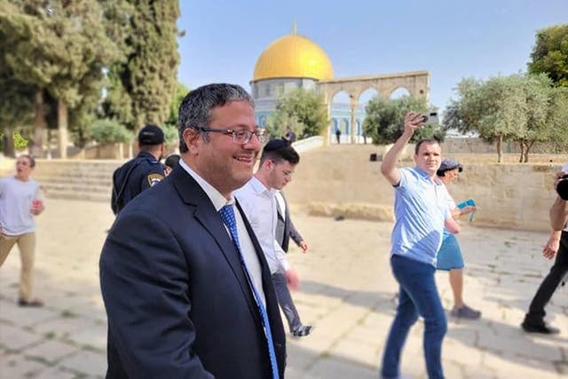 <p>Itamar Ben-Gvir walks through the courtyard of Jerusalem’s al-Aqsa mosque compound on Tuesday</p>