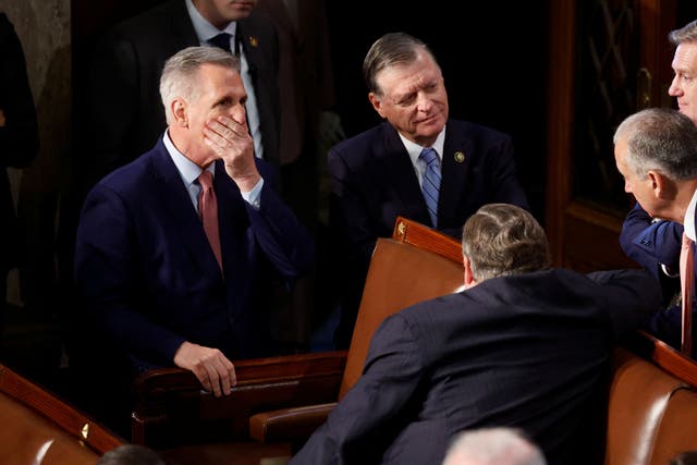 <p>House Republican leader Kevin McCarthy (R-CA) puts his hand to his face as he talks with Republican House colleagues on the House floor during voting as he runs for election to be the next Speaker of the House on the first day of the 118th Congress at the U.S. Capitol in Washington, U.S., January 3, 2023</p>