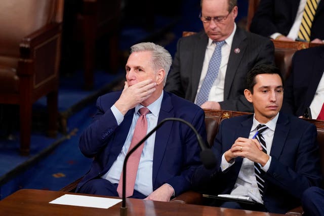 <p>Rep Kevin McCarthy listens as the second round of votes are cast for the next Speaker of the House on the opening day of the 118th Congress at the US Capitol, 3 January 2023</p>