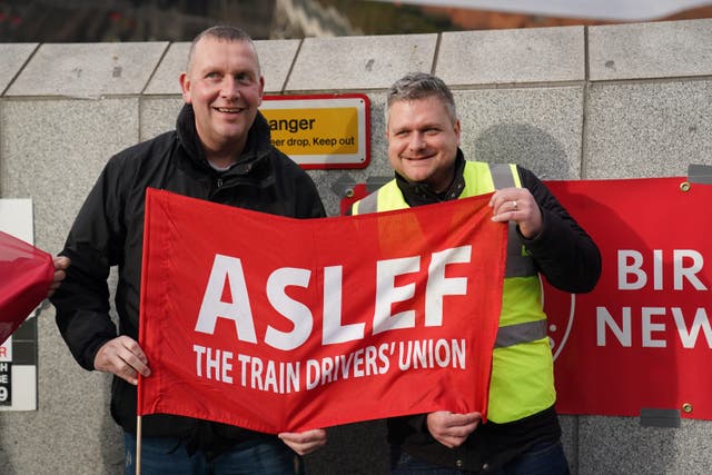 Rail workers on the picket line at Grand Central Station in Birmingham, as members of the drivers’ union Aslef on strike in November (Jacob King/PA)
