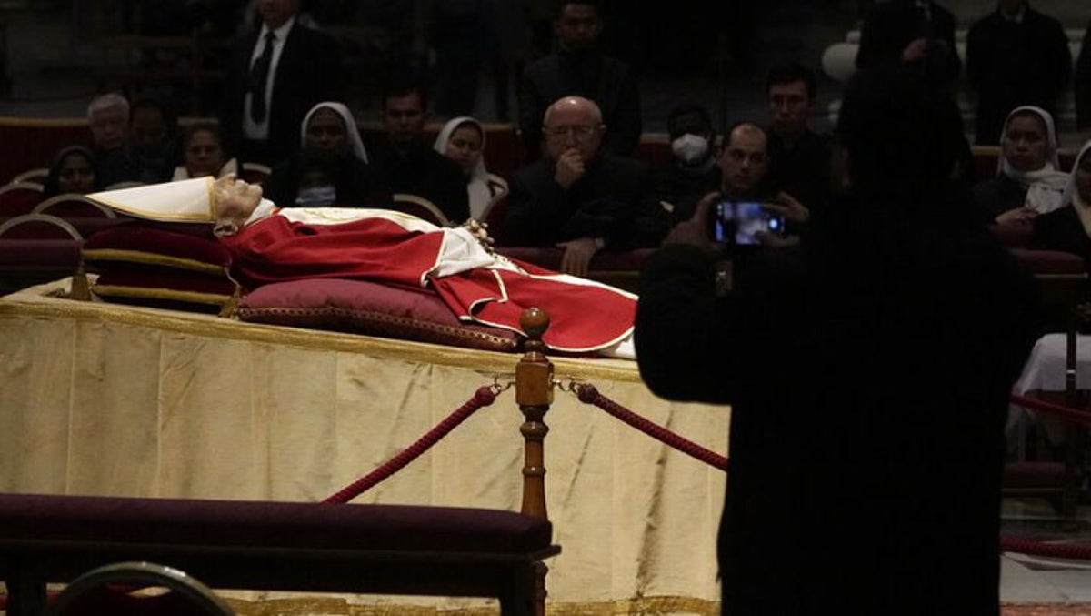 Thousands flock to Vatican to pay respects to Pope Benedict XVI as he lies in state