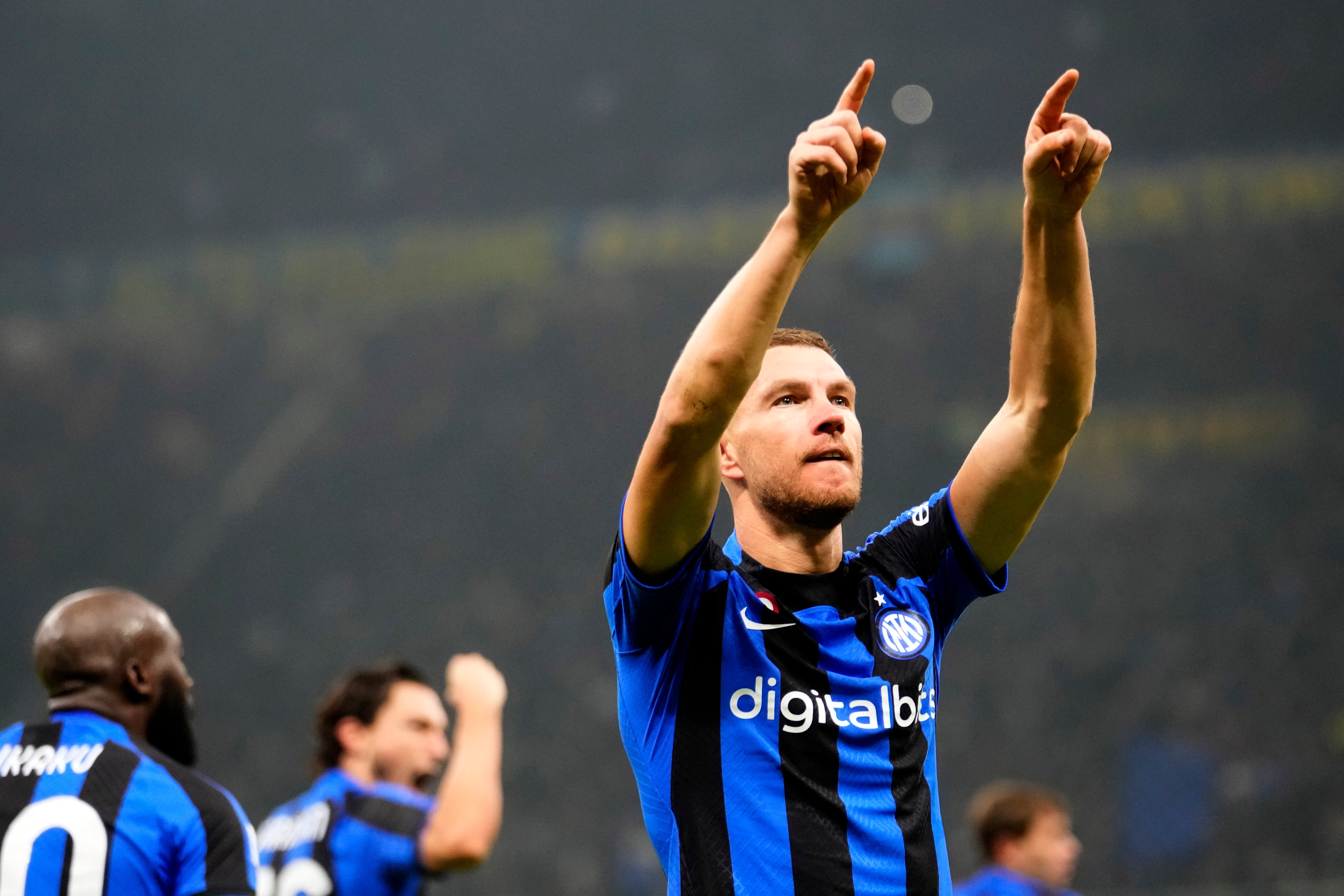 Edin Dzeko celebrates after scoring against Napoli