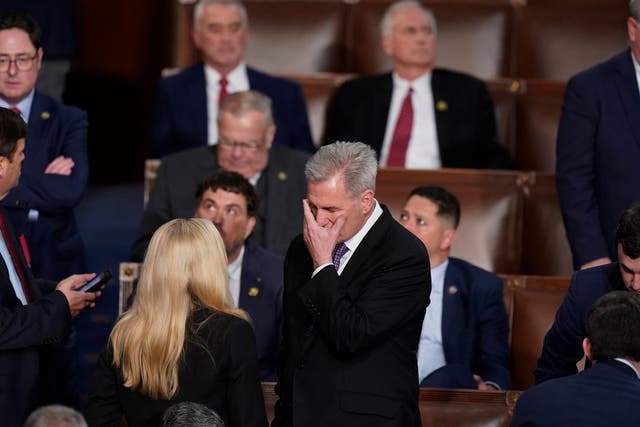 <p>Rep. Kevin McCarthy, R-Calif., talks with Rep. Marjorie Taylor Greene, R-Ga., at the beginning of an evening session after six failed votes to elect a speaker and convene the 118th Congress in Washington</p>