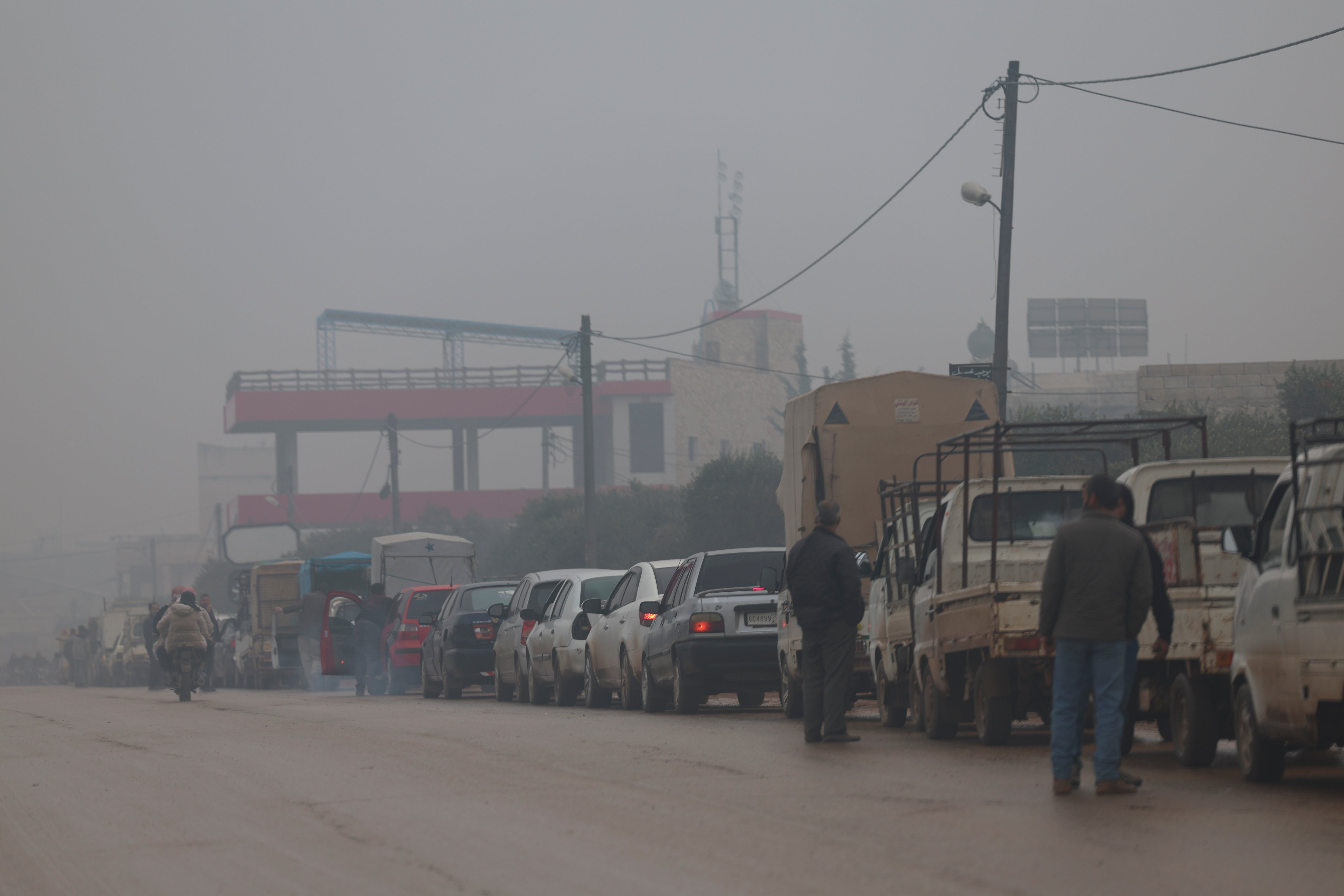 Drivers queue for petrol in December 2022 as Syria struggles under an economic crisis