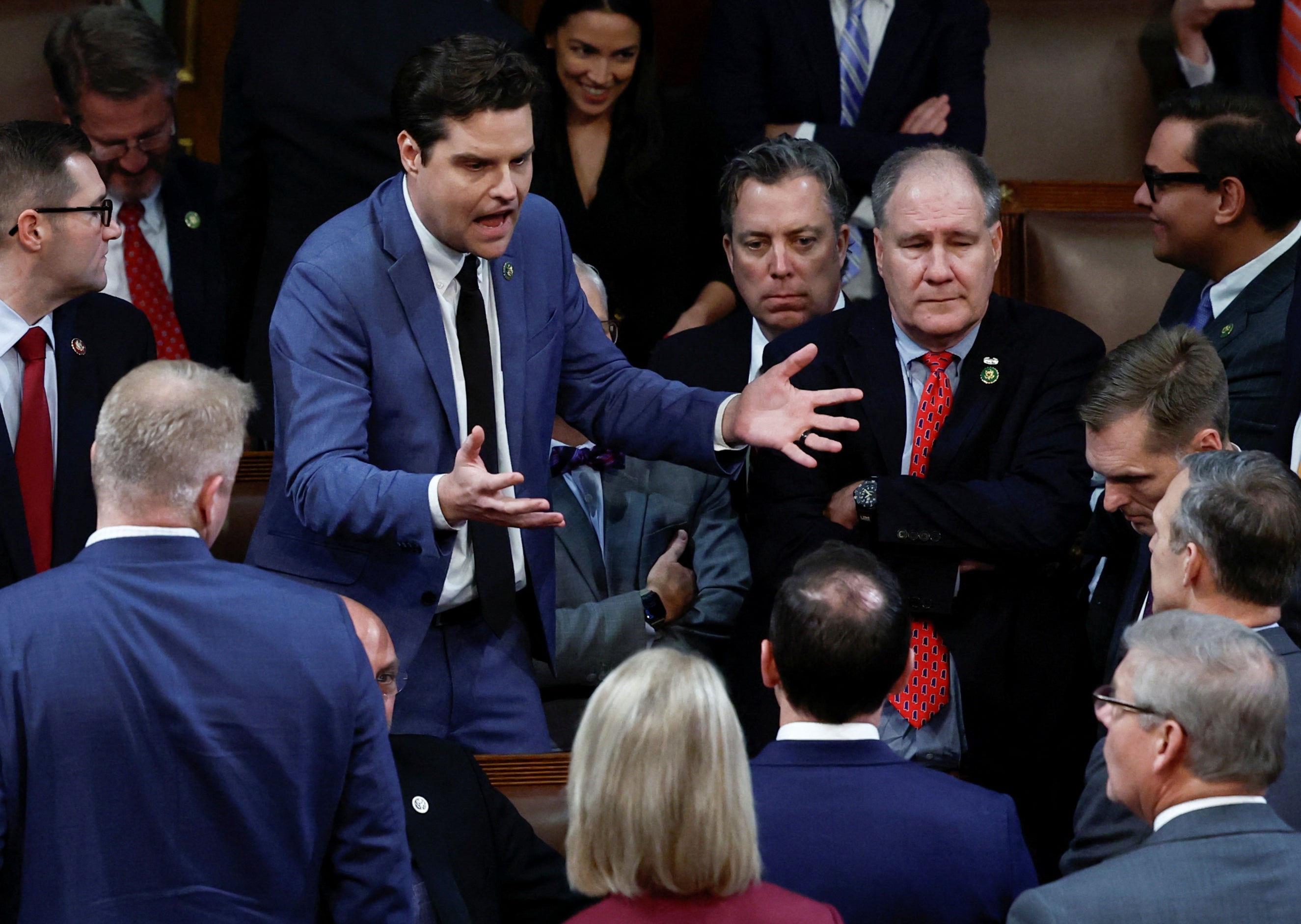Matt Gaetz passionately addresses other conservative Republican members of the House in the middle of the House Chamber after a fourth round of voting still failed to elect US House Republican Leader Kevin McCarthy as new Speaker of the House