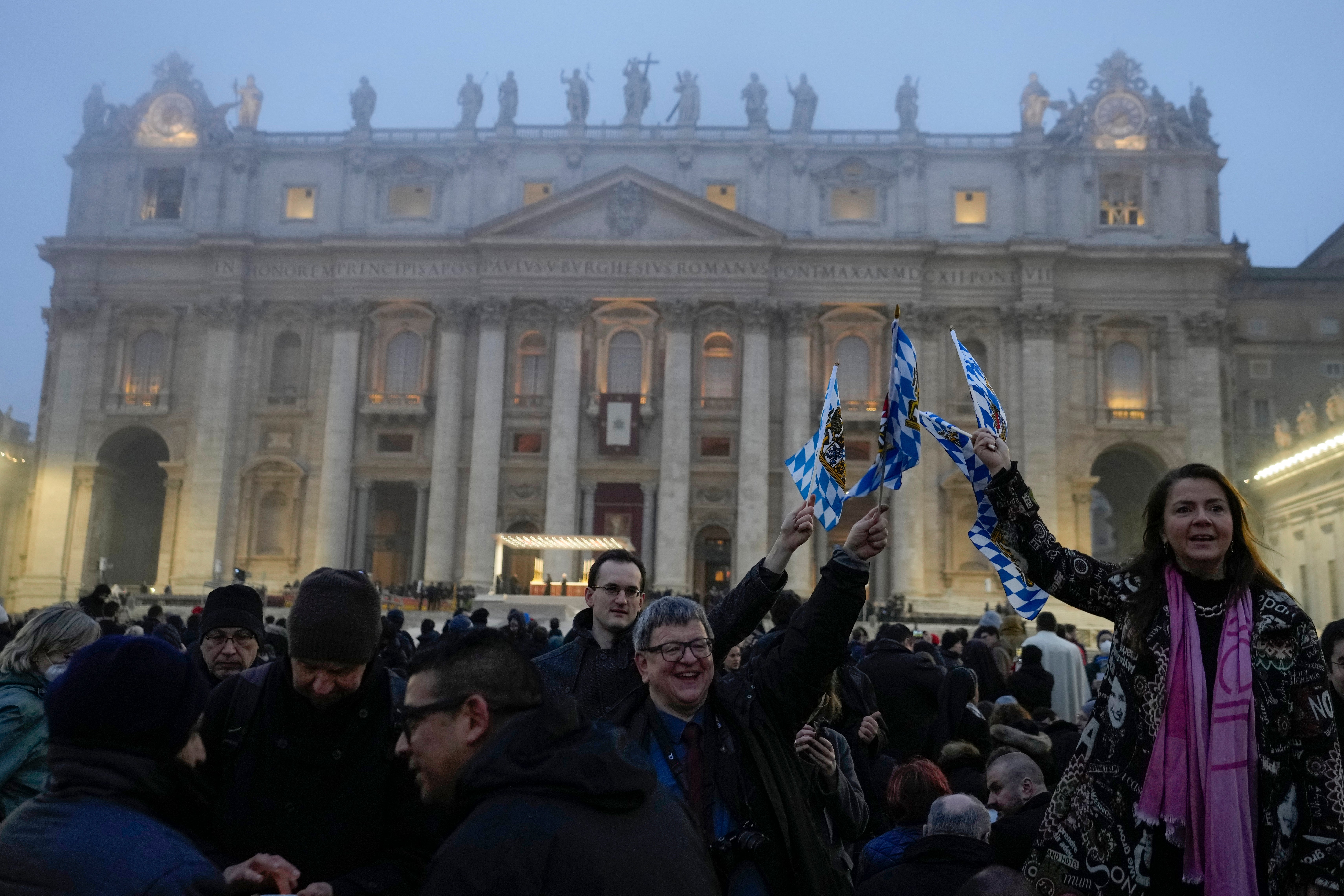 People gather in St Peter’s Square at the Vatican ahead of the funeral