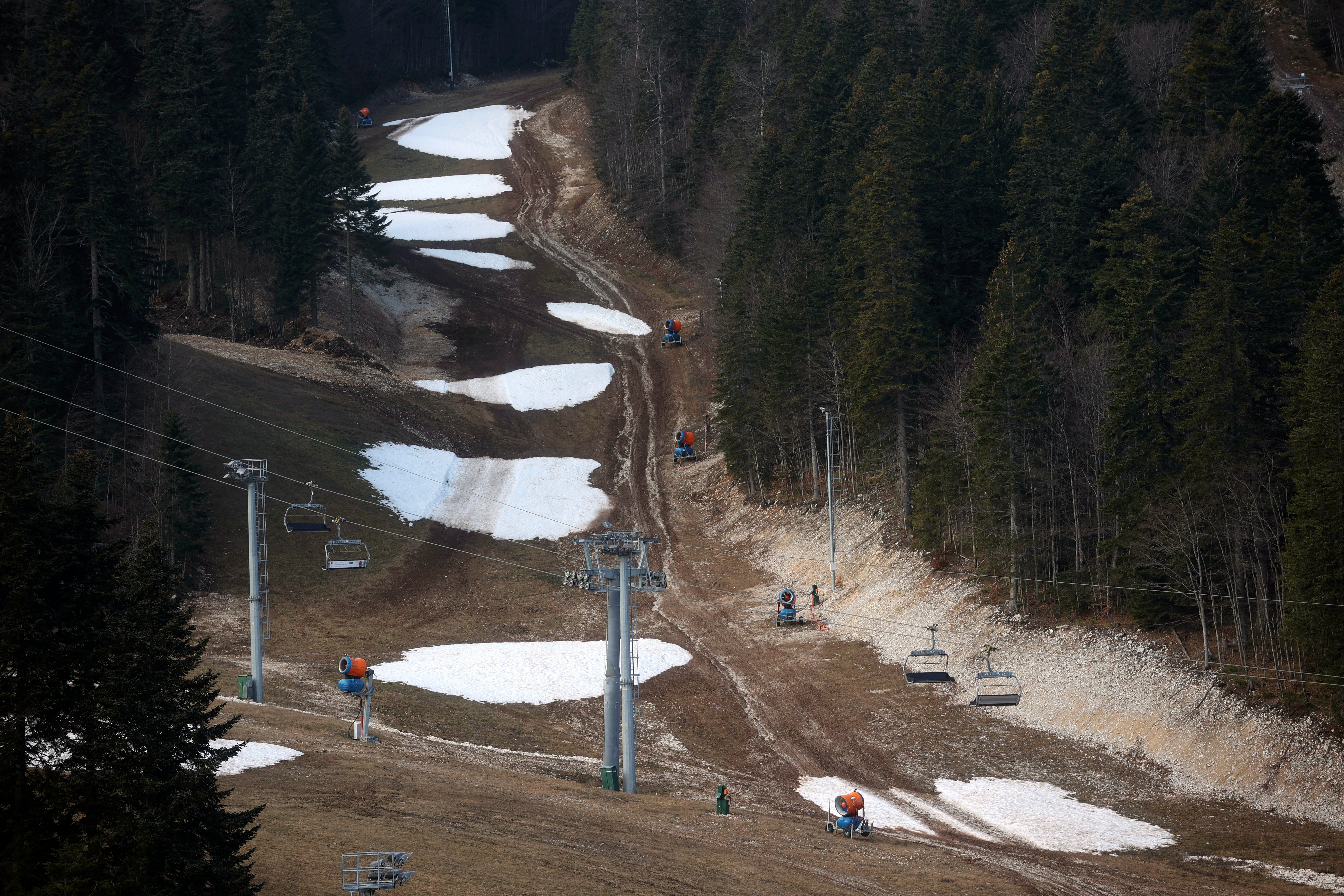 The ski track with only a few patches of snow on Bjelasnica mountain near Sarajevo, Bosnia, Wednesday, January 4, 2023