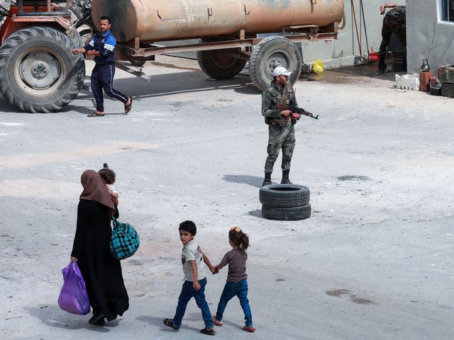 <p>Syrian regime soldiers at a checkpoint in Daraa on 12 September 2021</p>