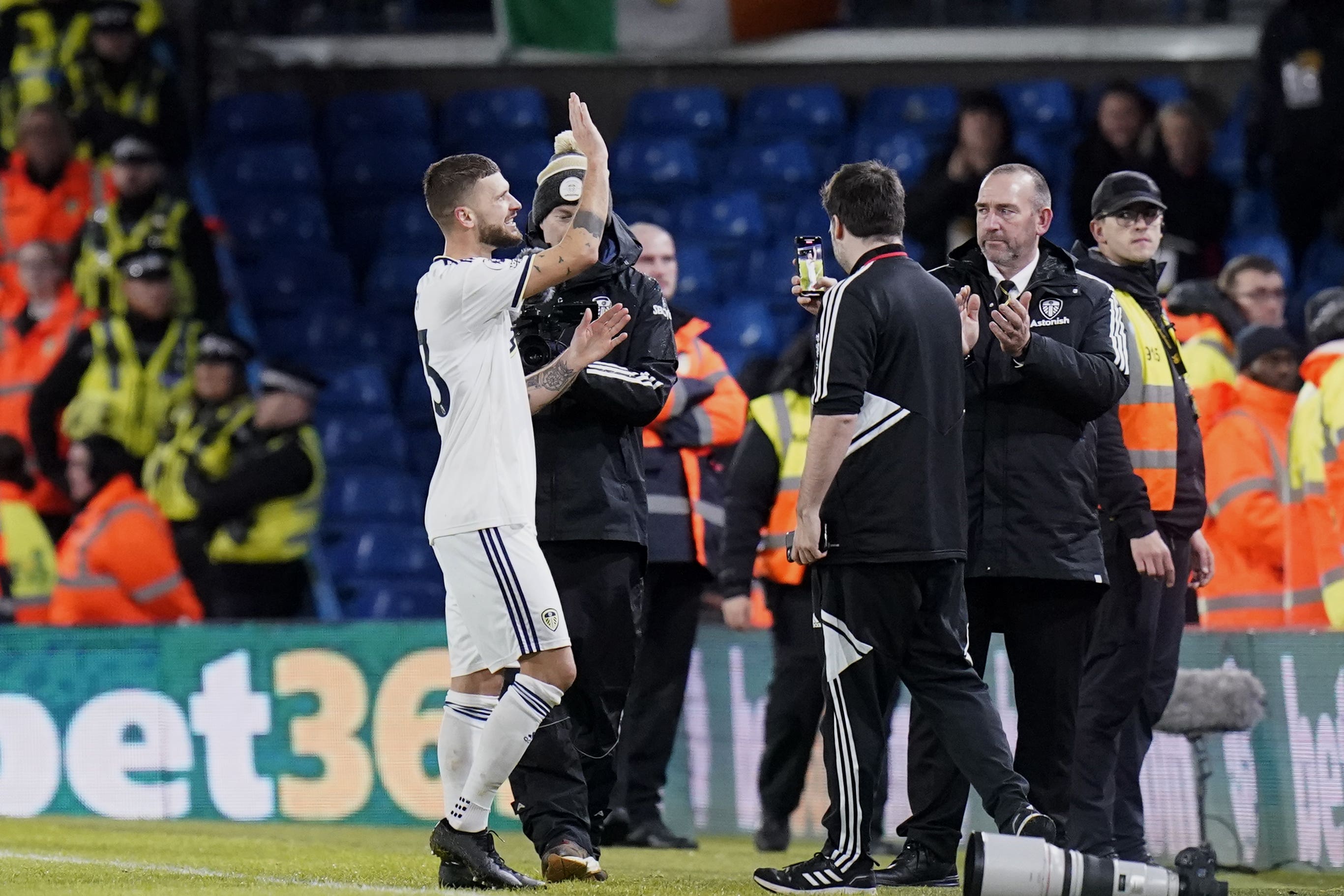 Leeds United’s Mateusz Klich waves goodbye