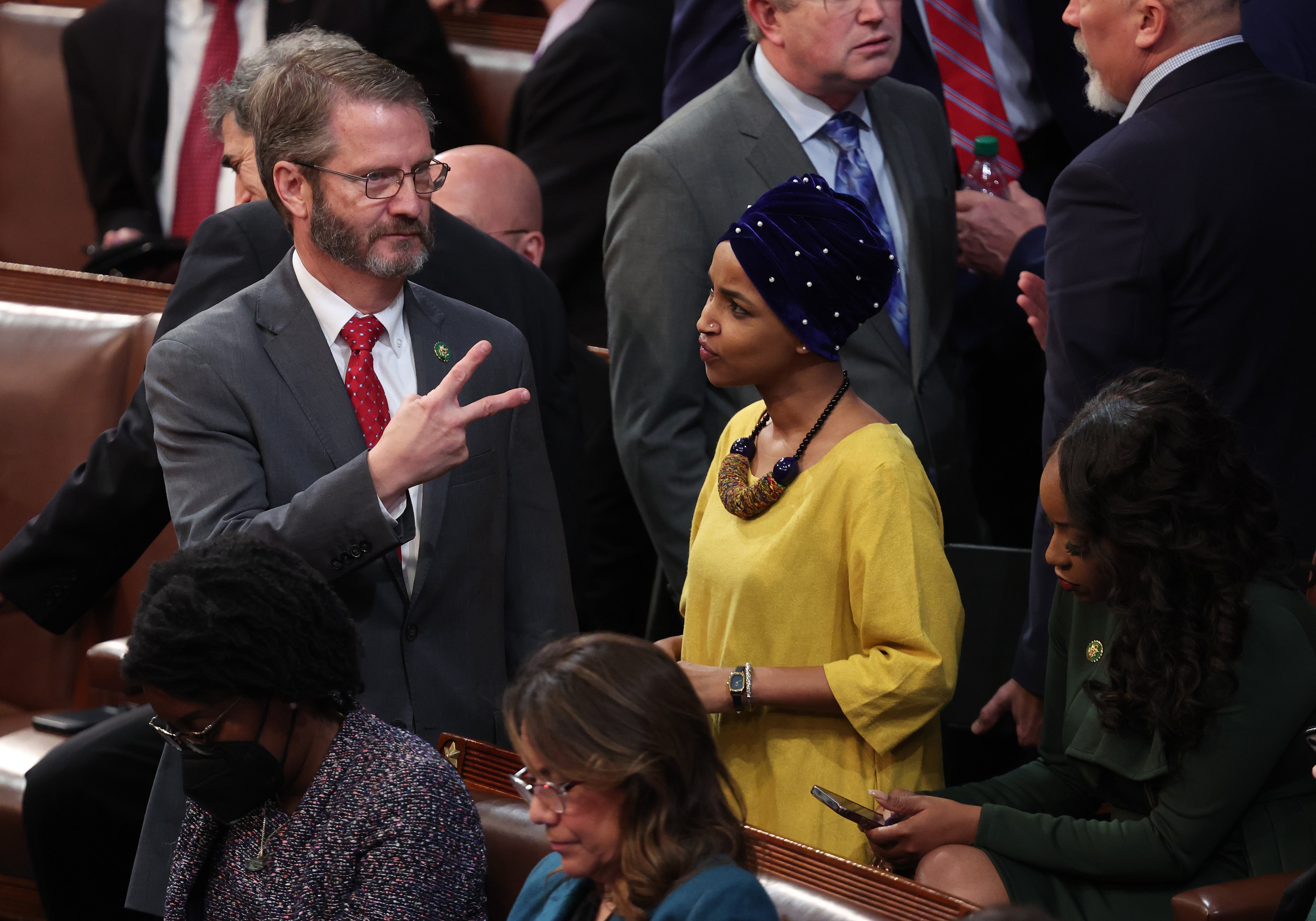 Rep-elect Tim Burchett, a Tennessee Republican speaks with Rep-elect Ilhan Omar, a Minnesota Democrat. Viewers have been surprised by members of opposing parties chatting on the floor of the chamber at a time of such national division.