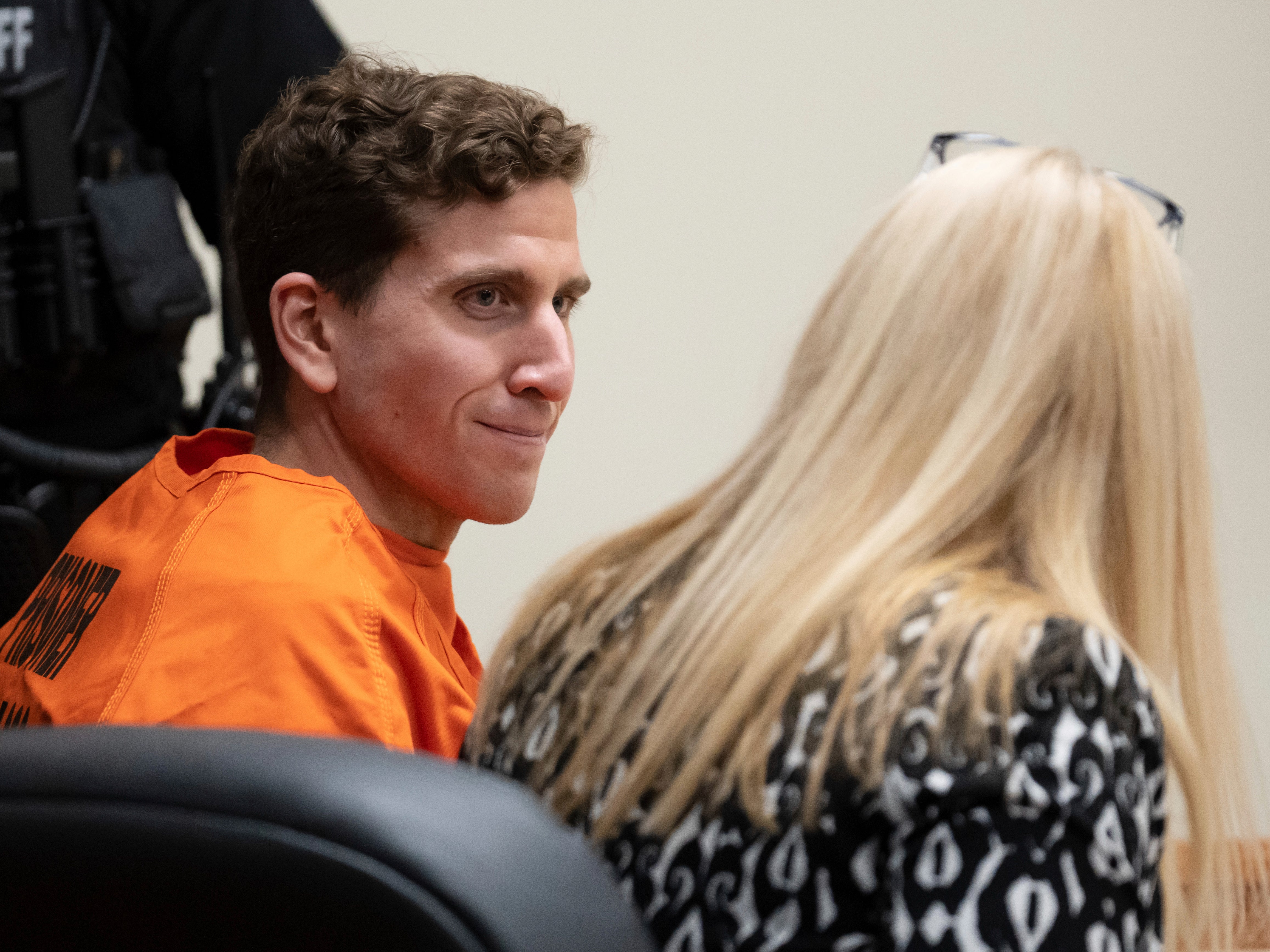 Bryan Kohberger, left, who is accused of killing four University of Idaho students in November 2022, looks toward his attorney, public defender Anne Taylor, right, during a hearing in Latah County District Court on Thursday