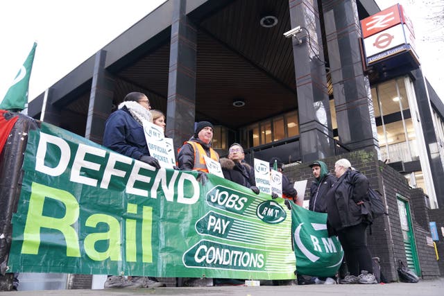 Members of the Rail, Maritime and Transport union (RMT) on the picket line outside Euston station in London during a rail strike in a long-running dispute over jobs and pensions (Kirsty O’Connor/PA)