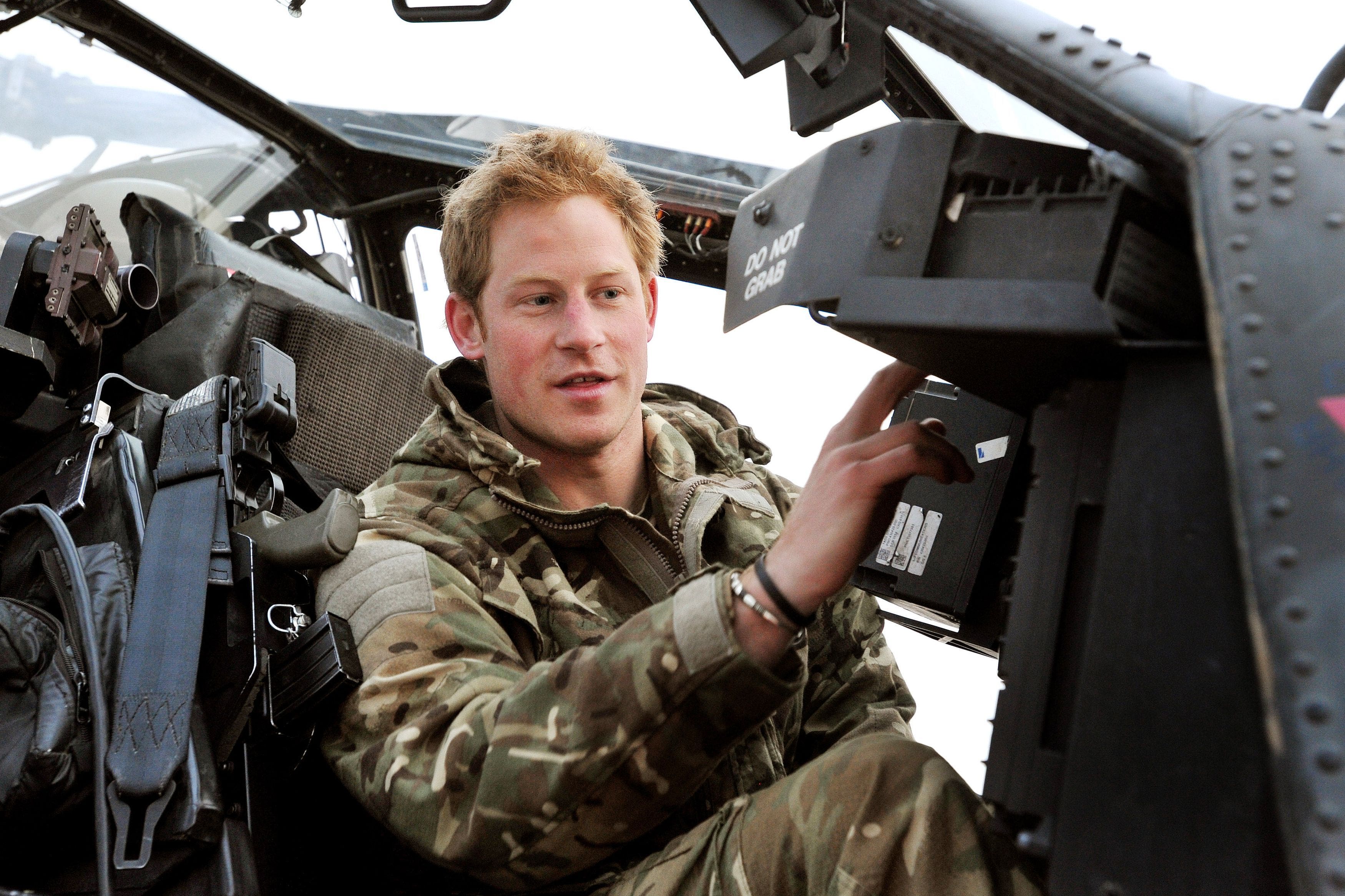 The Duke of Sussex, or Captain Wales as he was known in the Army, making his pre-flight checks at Camp Bastion (PA)