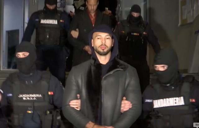 <p>File. In this grab taken from video released by Observator Antena 1, Social Media personality Andrew Tate is led away by police, in the Ilfov area, north of Bucharest, Romania, Thursday, 29 December 2022</p>