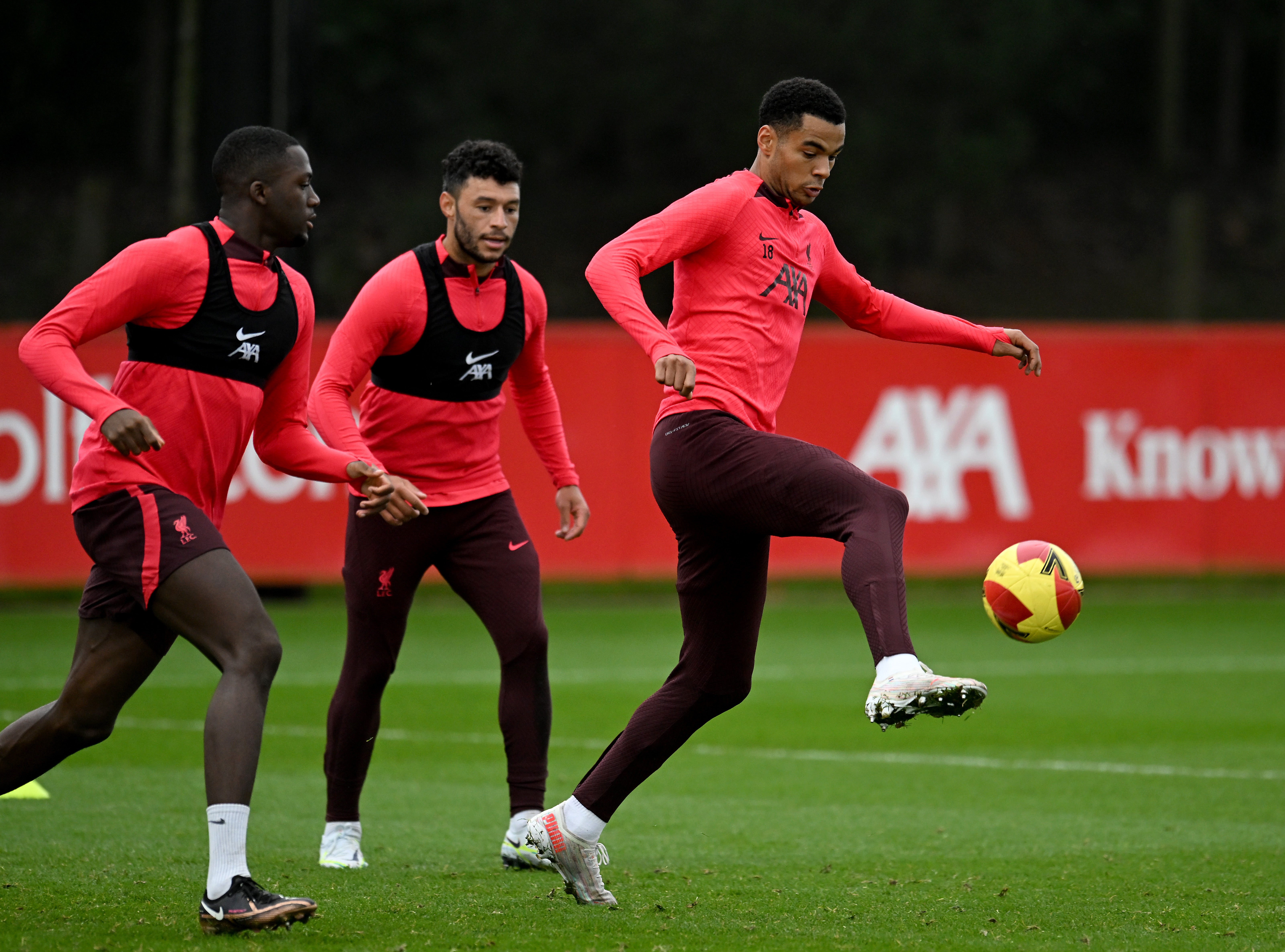 Cody Gakpo, Alex Oxlade-Chamberlain and Ibrahima Konate of Liverpool during a training session