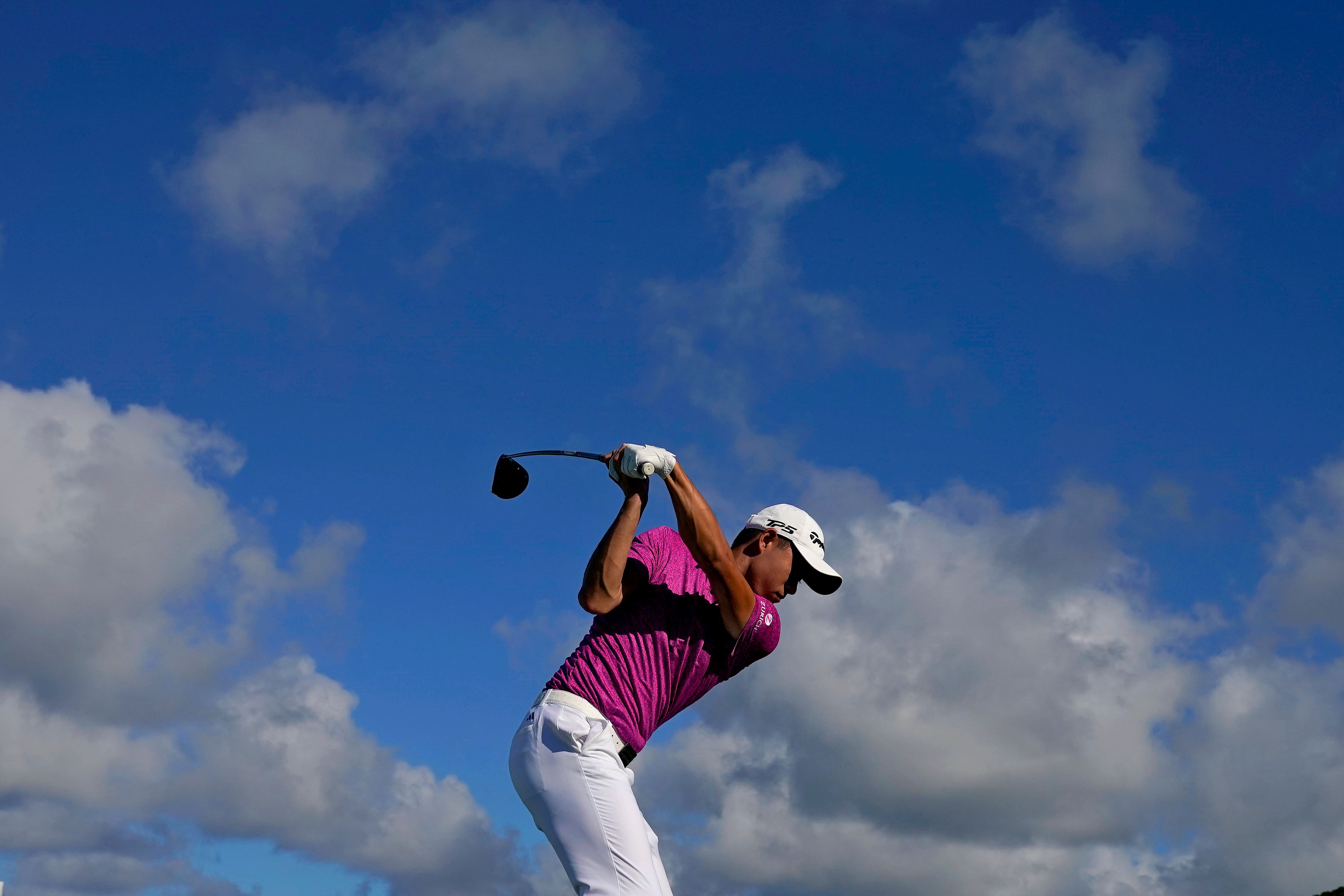 Collin Morikawa took the lead on the second day at the Sentry Tournament of Champions in Hawaii, pulling ahead of JJ Spaun and Jon Rahm (Matt York/AP)