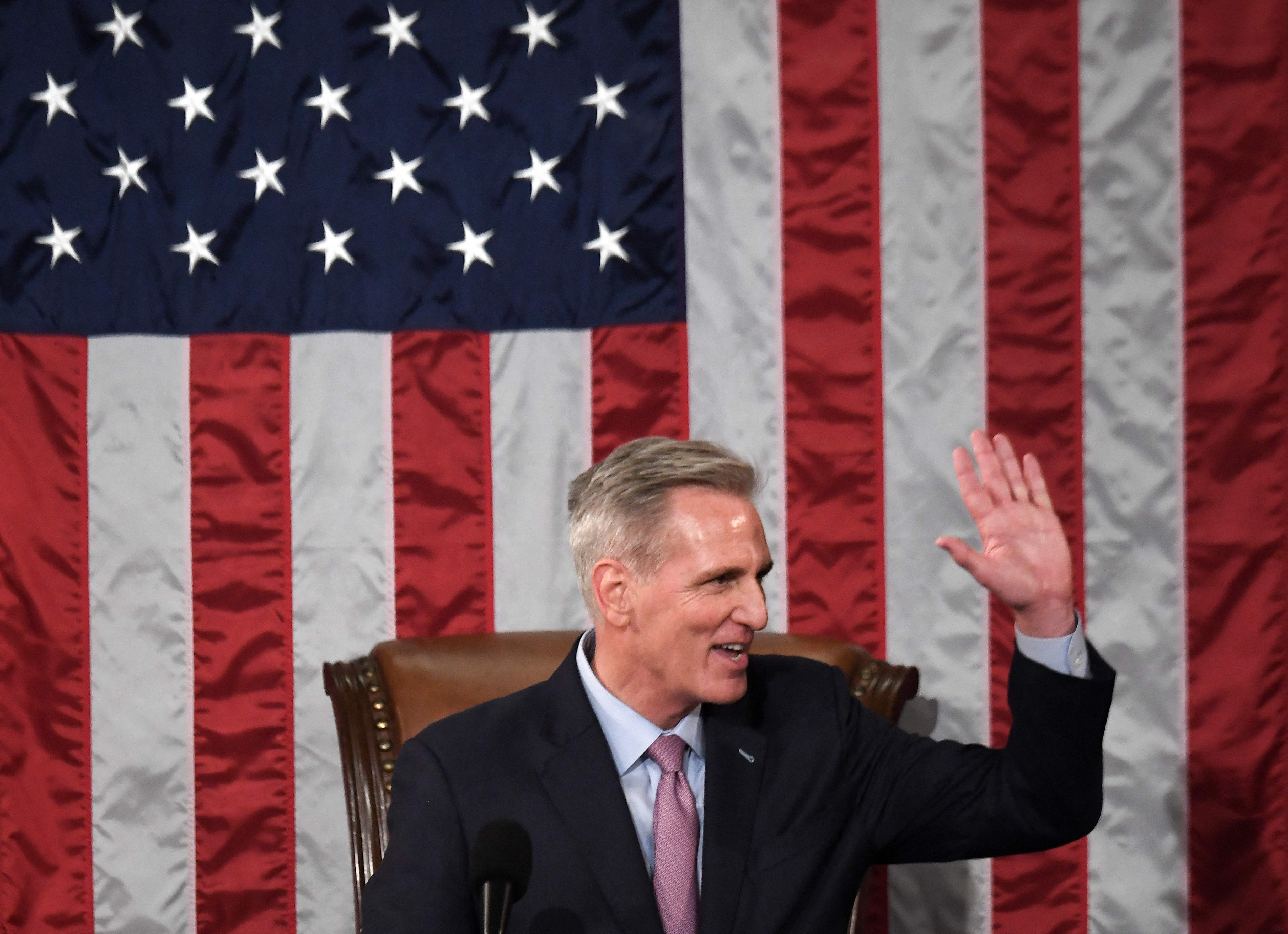 Newly elected speaker of the US House of Representatives Kevin McCarthy waves after he was elected on the 15th ballot at the US Capitol in Washington, DC, on 7 January 2023