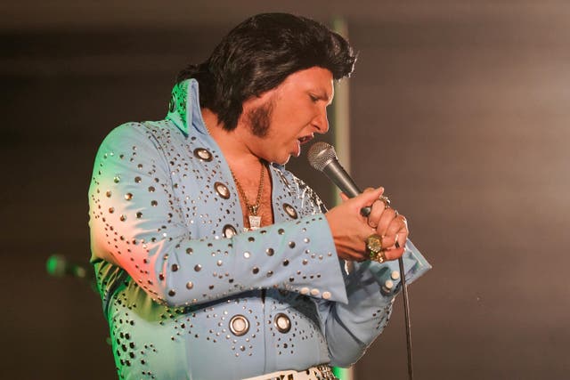 Elvis tribute artist Brad Dashwood performed in a blue bejeweled jumpsuit (Jacob King/PA)