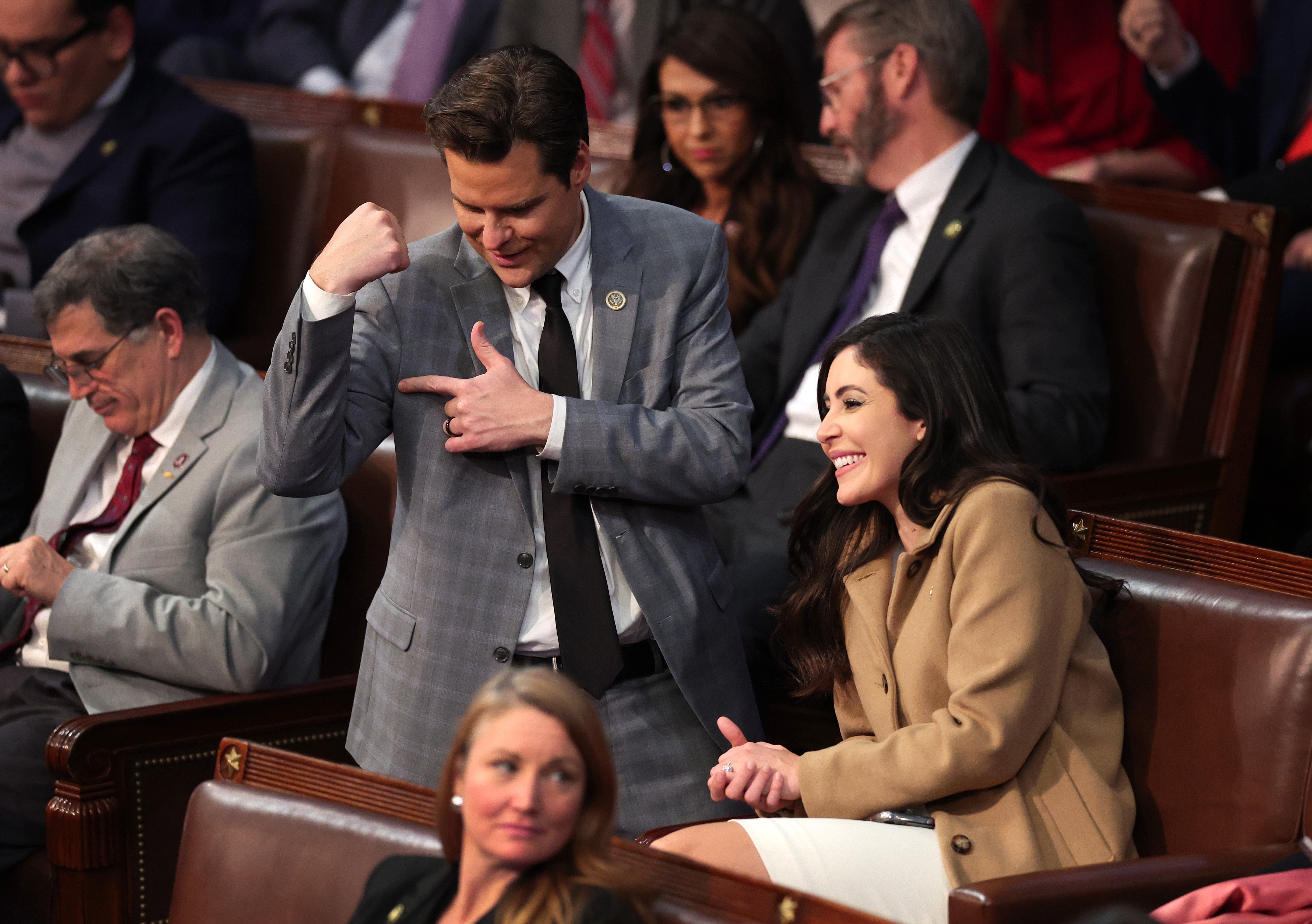 Matt Gaetz flexes his arm alongside Anna Paulina Luna after getting into an argument with Mike Rogers