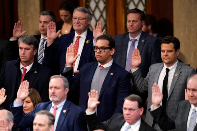 <p>Rep. George Santos, R-N.Y., and Rep. Matt Gaetz, R-Fla., are sworn in by Speaker of the House Kevin McCarthy of Calif., as members of the 118th Congress in Washington, early Saturday, Jan. 7, 2023</p>