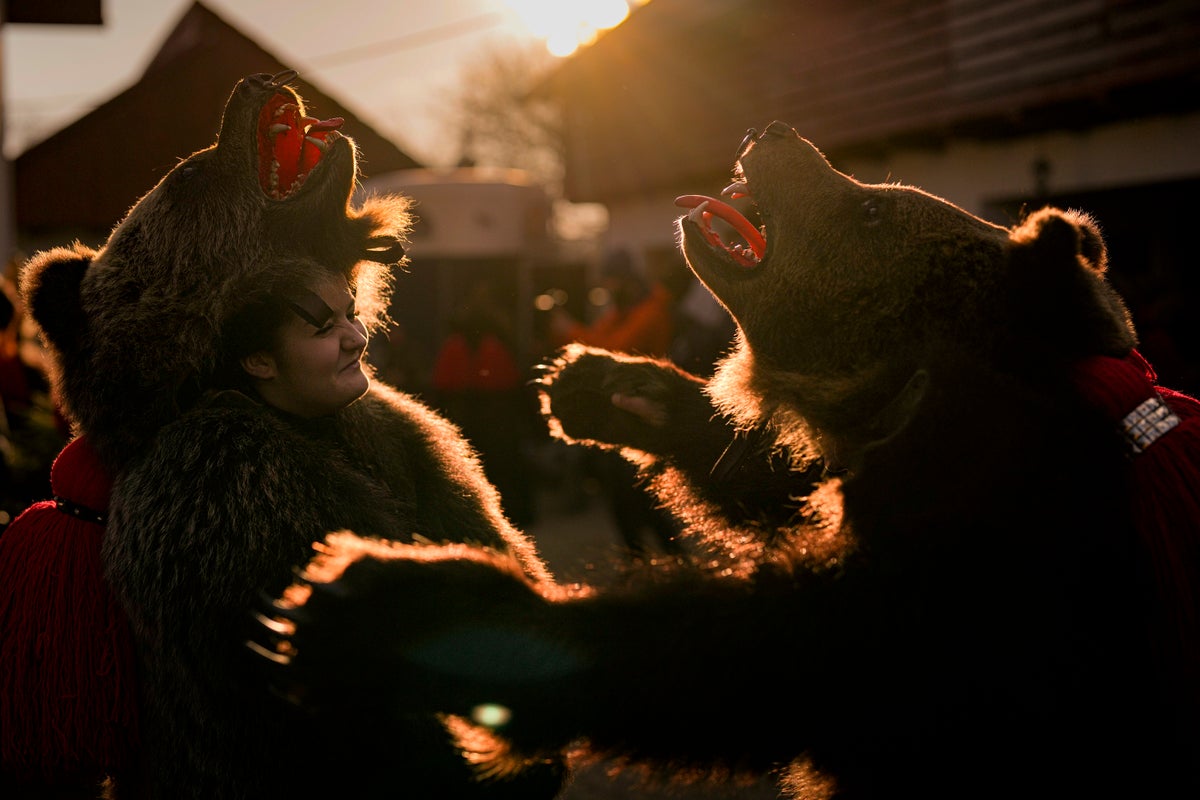 AP PHOTOS: Bear costumes, dance at popular Romanian festival