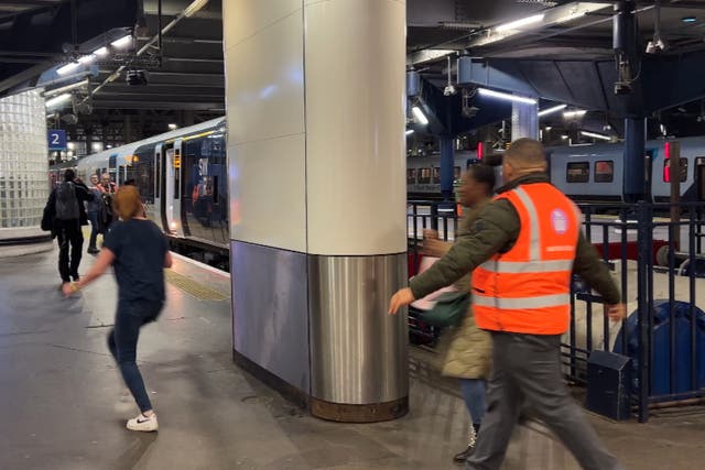 <p>Last call: Passengers running for the final train from London Waterloo, the UK’s busiest station, on Saturday 7 January – the last day of the latest round of strikes</p>