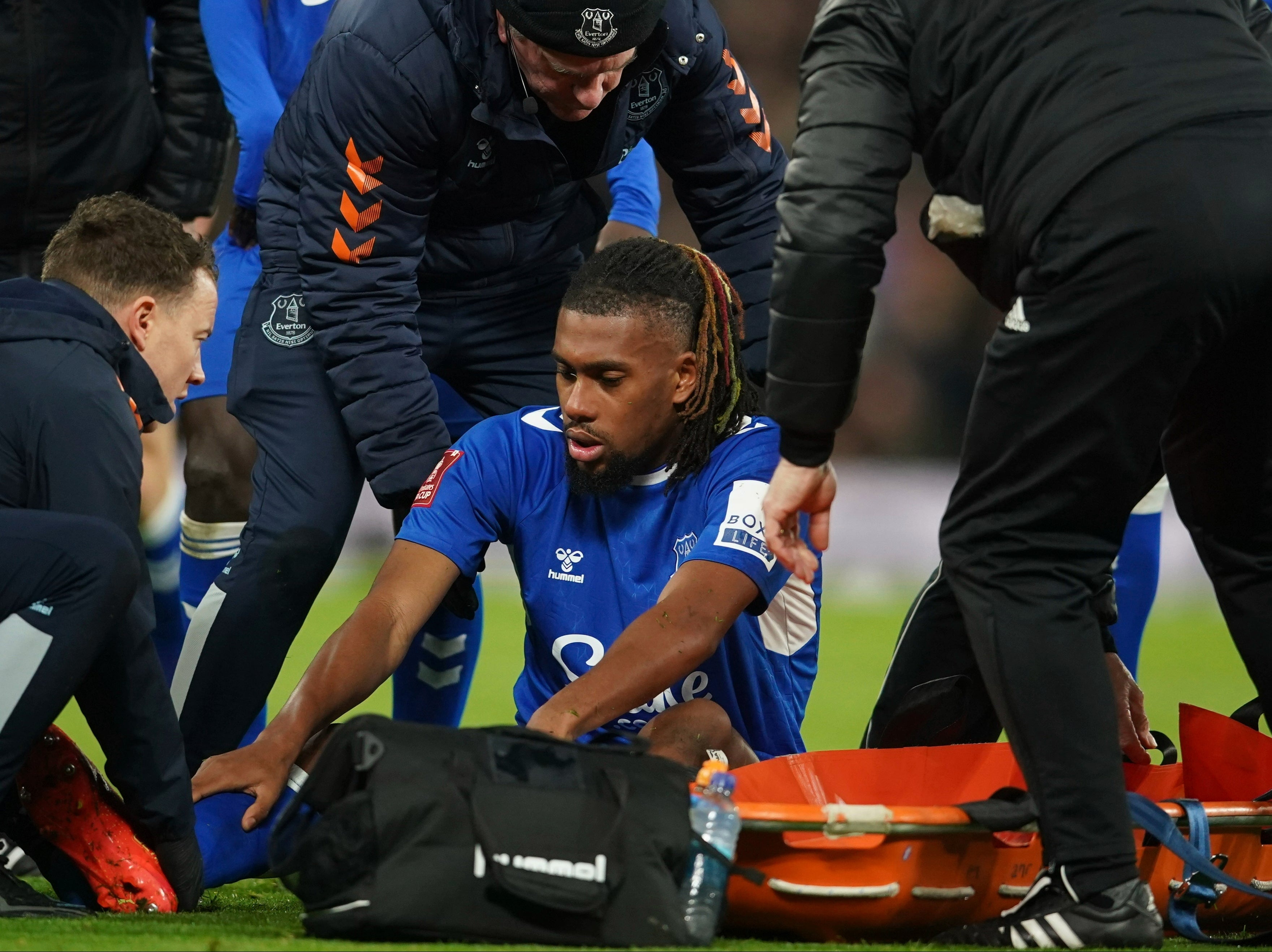 Everton’s Alex Iwobi lies injured on the pitch