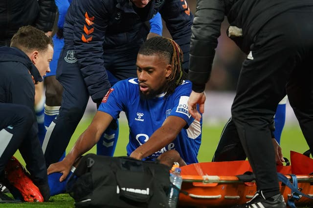 <p>Everton’s Alex Iwobi lies injured on the pitch</p>